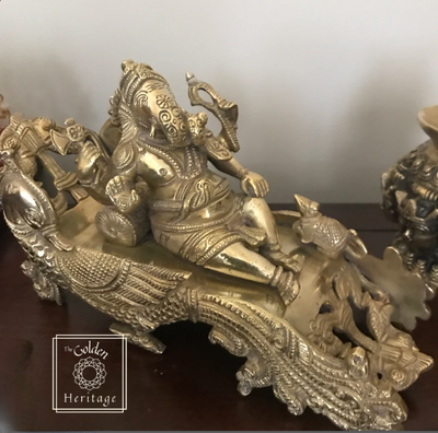 Relax sitting Ganesha on Peacock design sofa - The Golden Heritage #